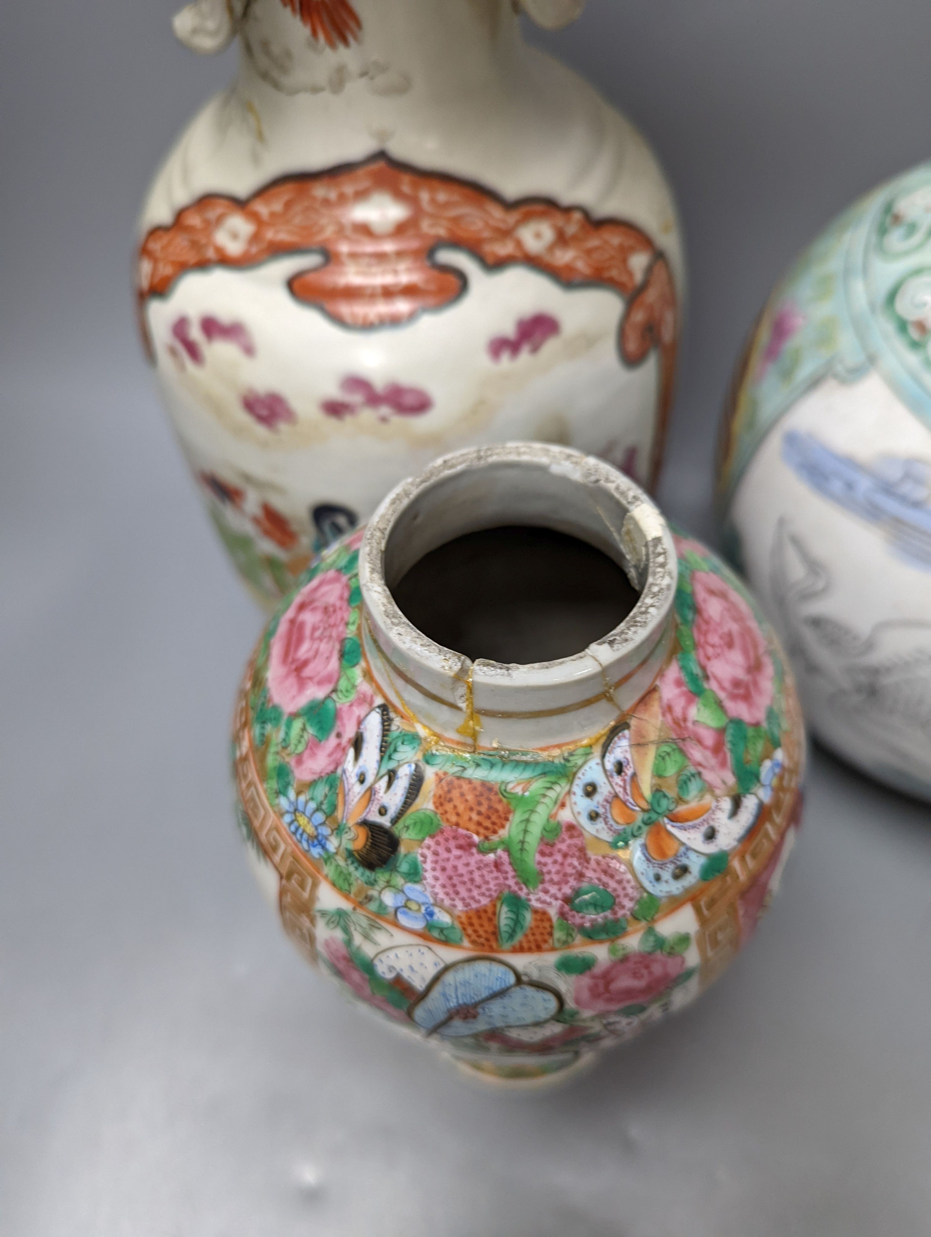 A Chinese famille rose vase and two ginger jars, together with a Japanese vase, 38cm